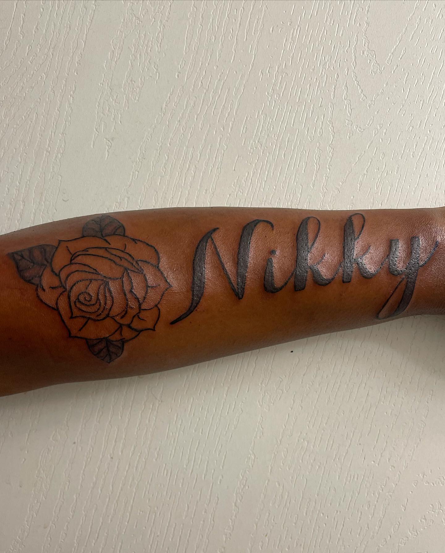 Rose and name black and grey tattoo on the forearm by InkByChing❤️🔥