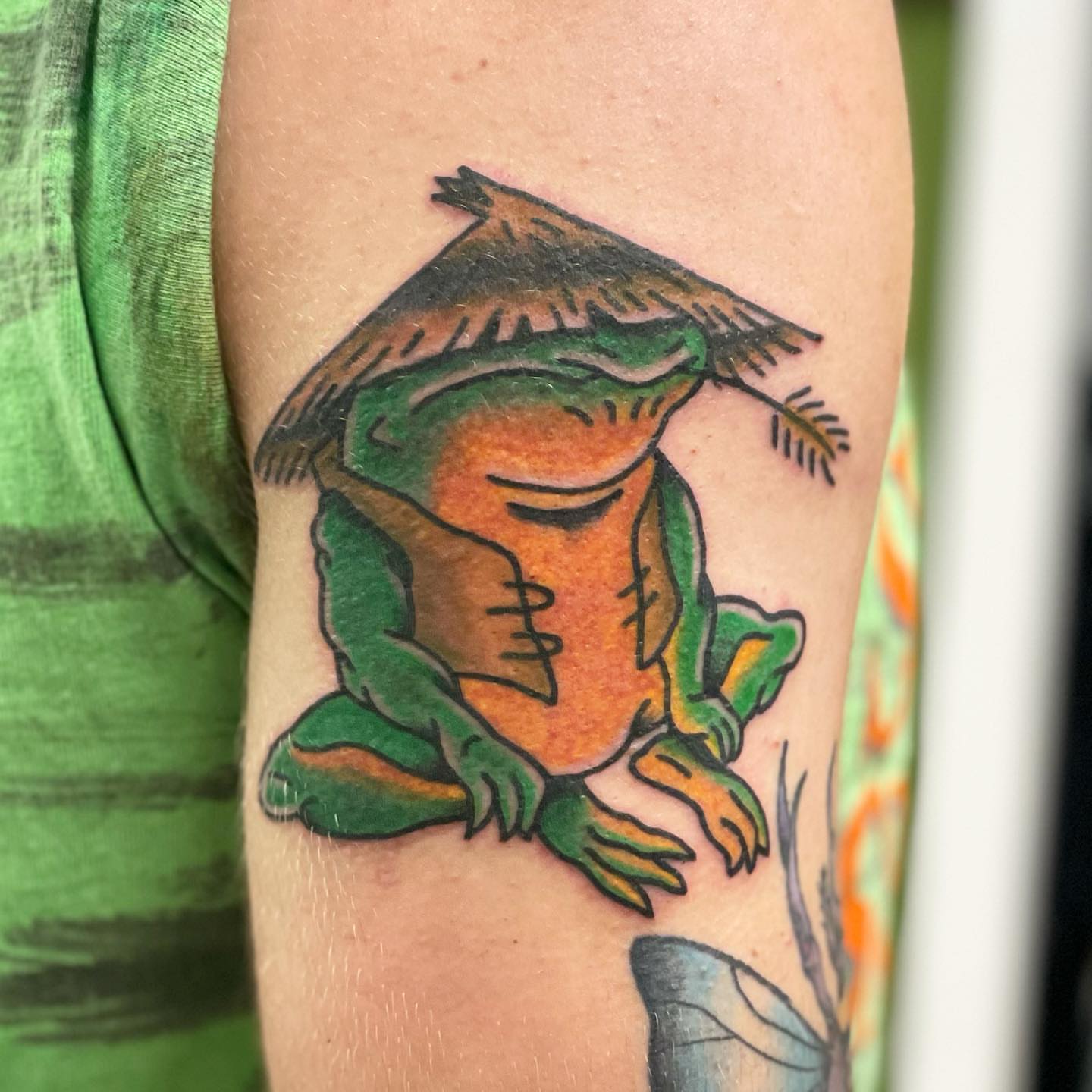 Frog wearing hat American traditional tattoo on the forearm by Erin Stephens