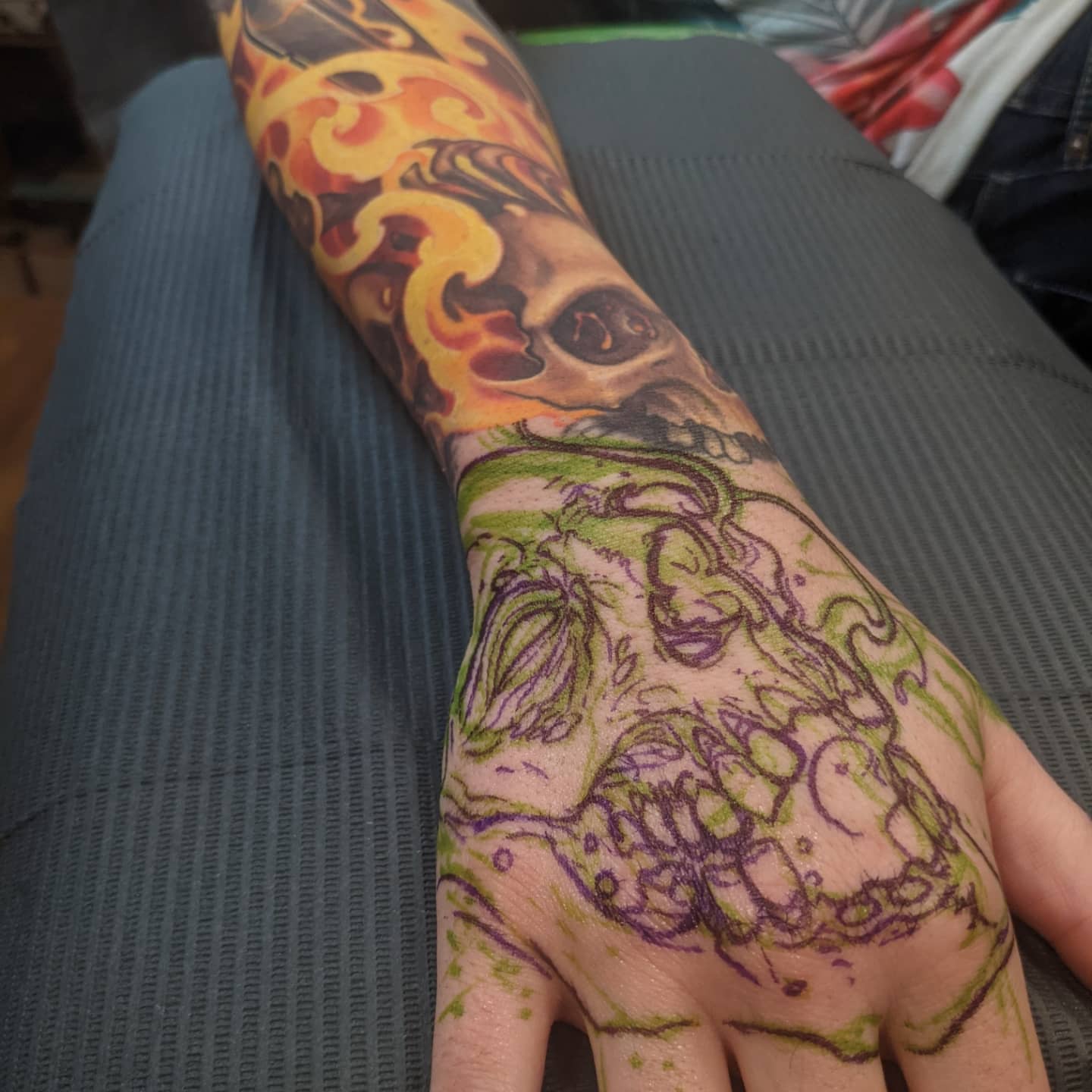 Skull and flame American traditional tattoo on the forearm by Matt Driscoll