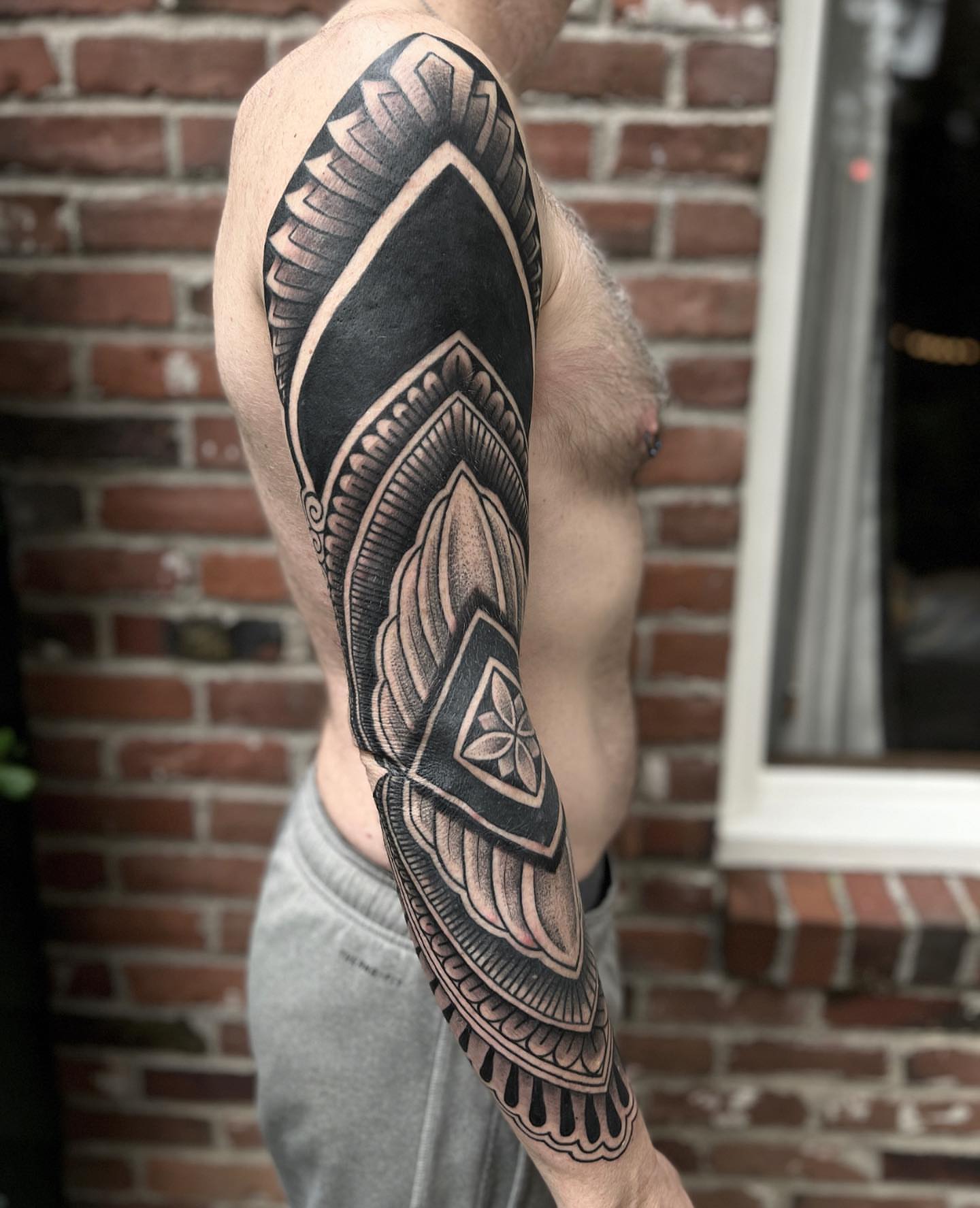 Geometric pattern geometric tattoo on the forearm by Ałex, Portland, Oregon