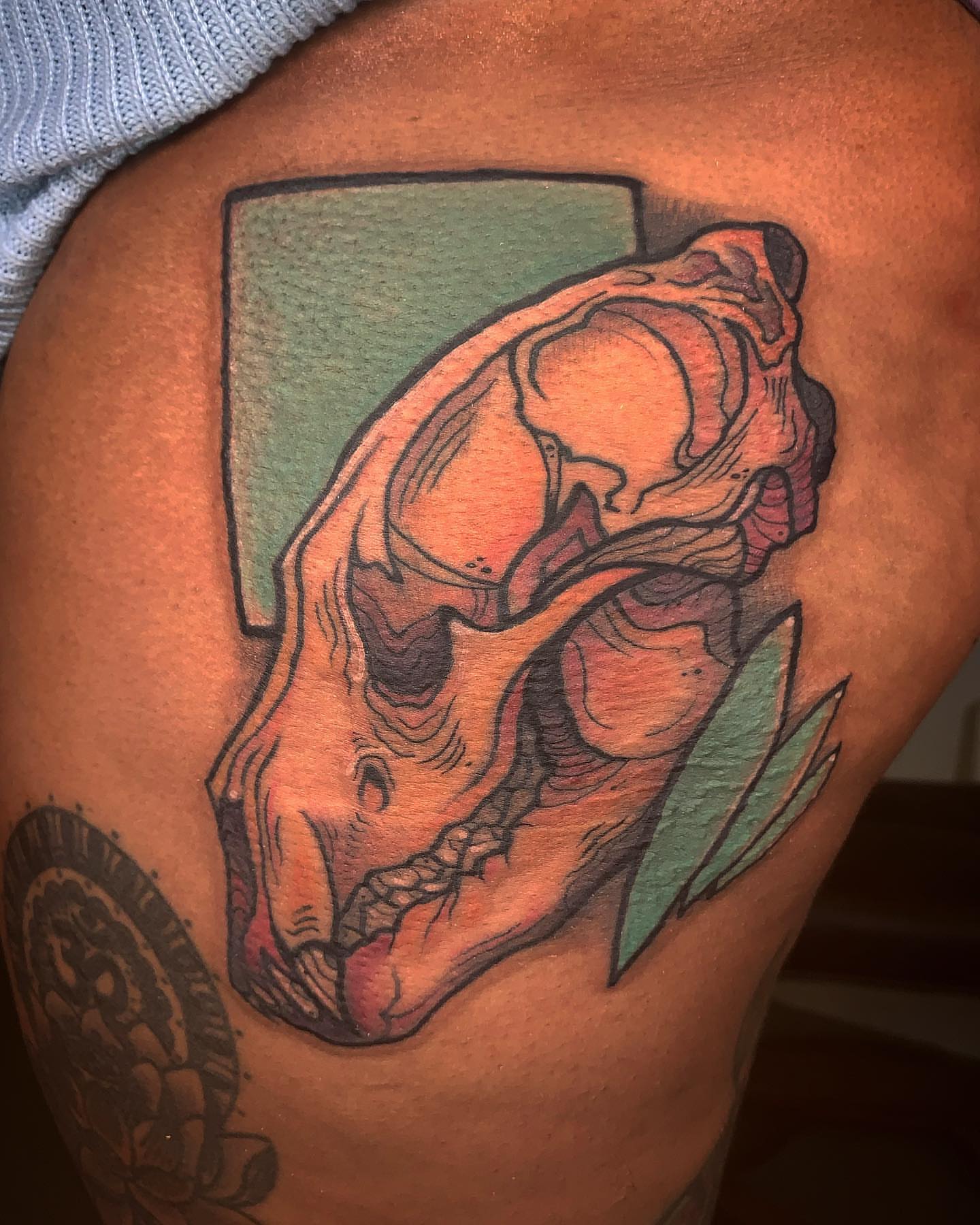Skull dotwork tattoo on the shoulder by Riley Oats