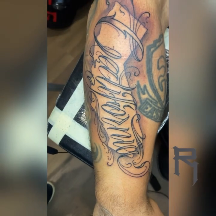Tattoo by @rtist_ink — lettering_script, black_and_grey
