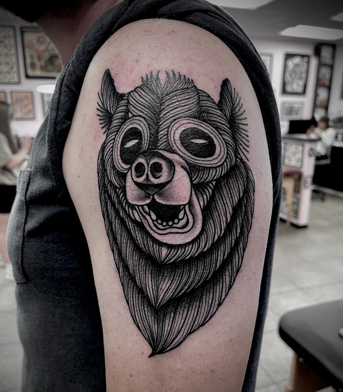Pig wearing goggles black and grey tattoo on the shoulder by Jason Ryan