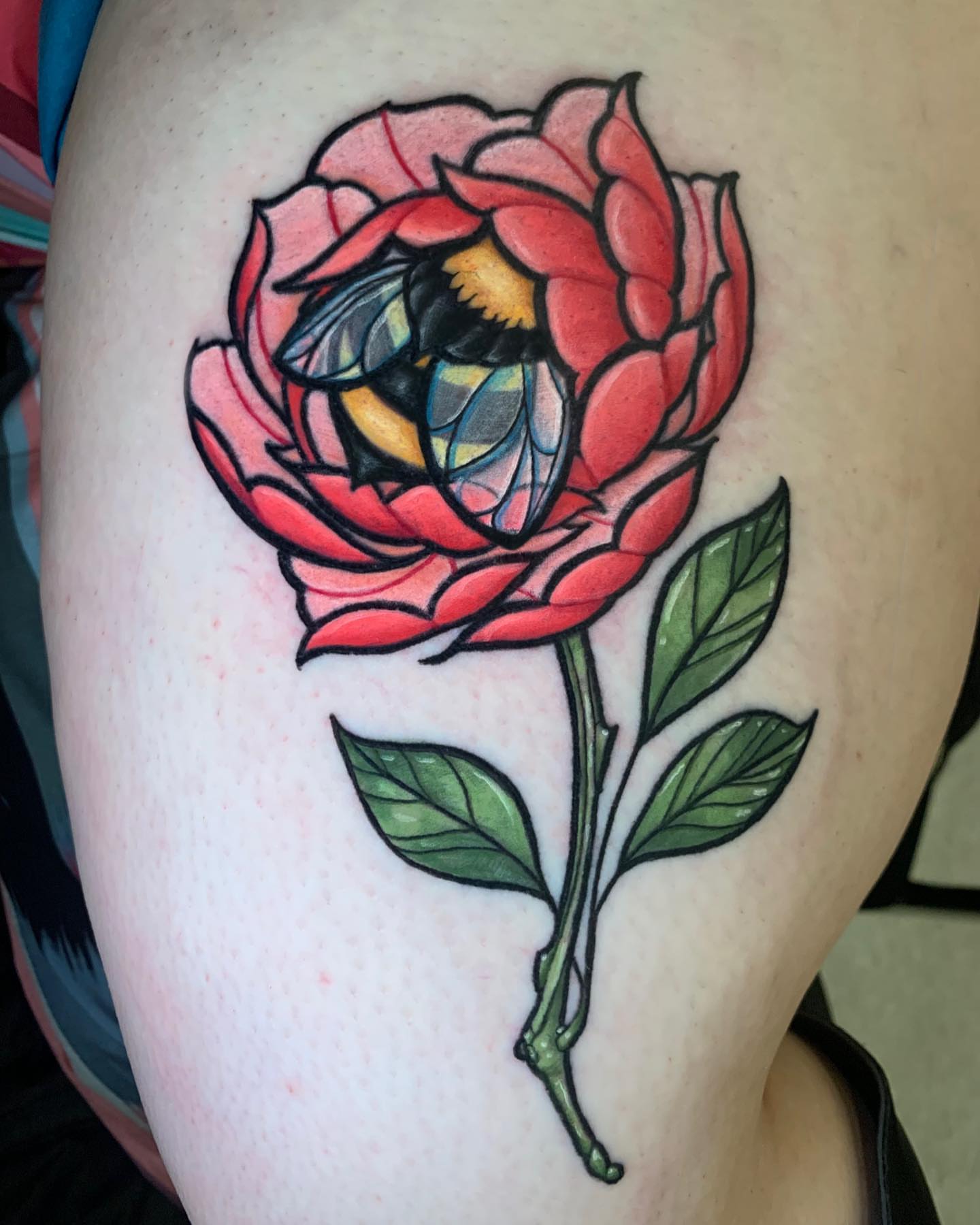 Rose with bee American traditional tattoo on the thigh by Cortney Norton