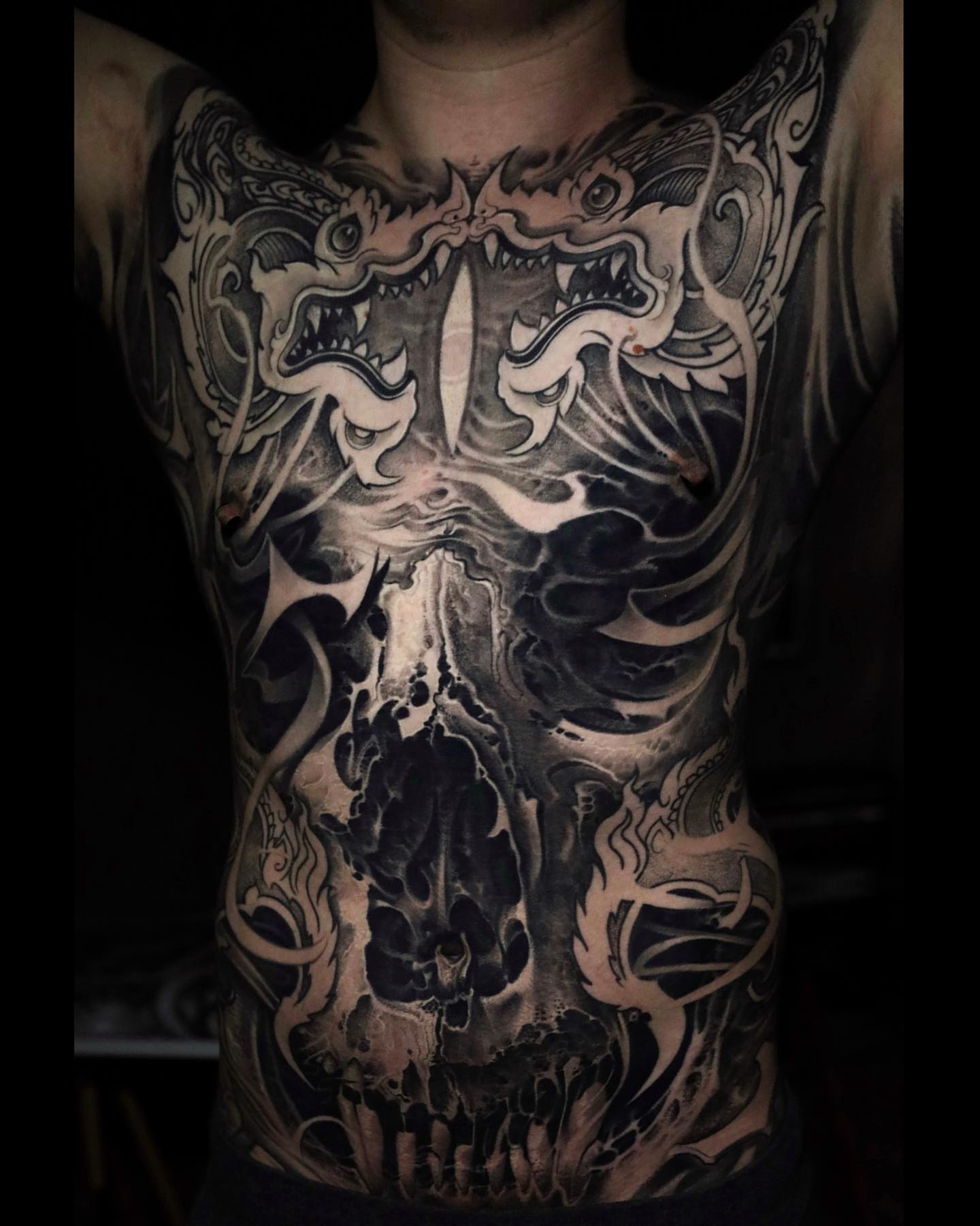 Skull dark realism tattoo on the chest by Victor Portugal Tattoo