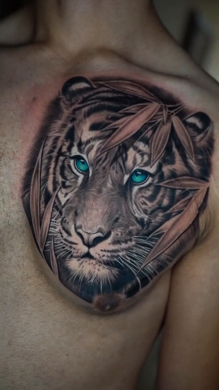 Tiger face with bamboo realism tattoo by Alan Delarosa