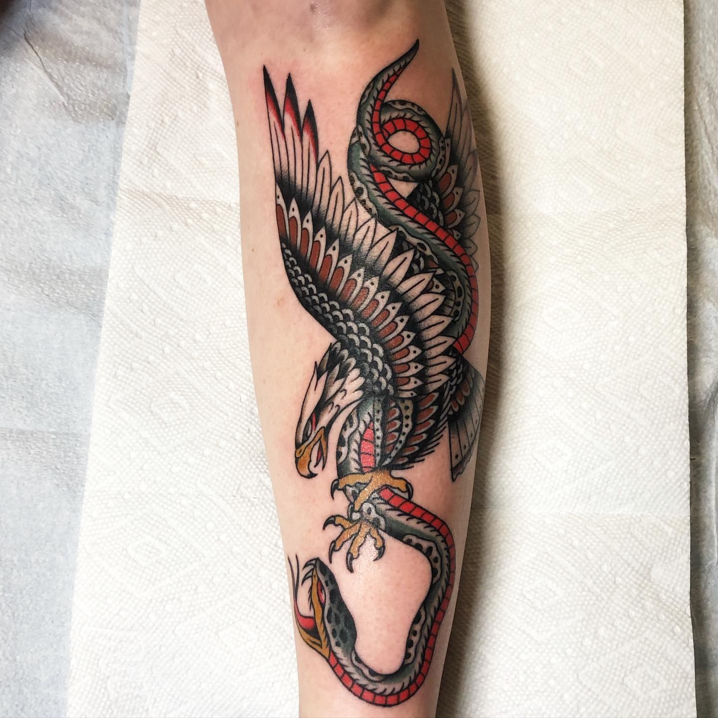 Dragon American traditional tattoo on the forearm by Sean McMahon