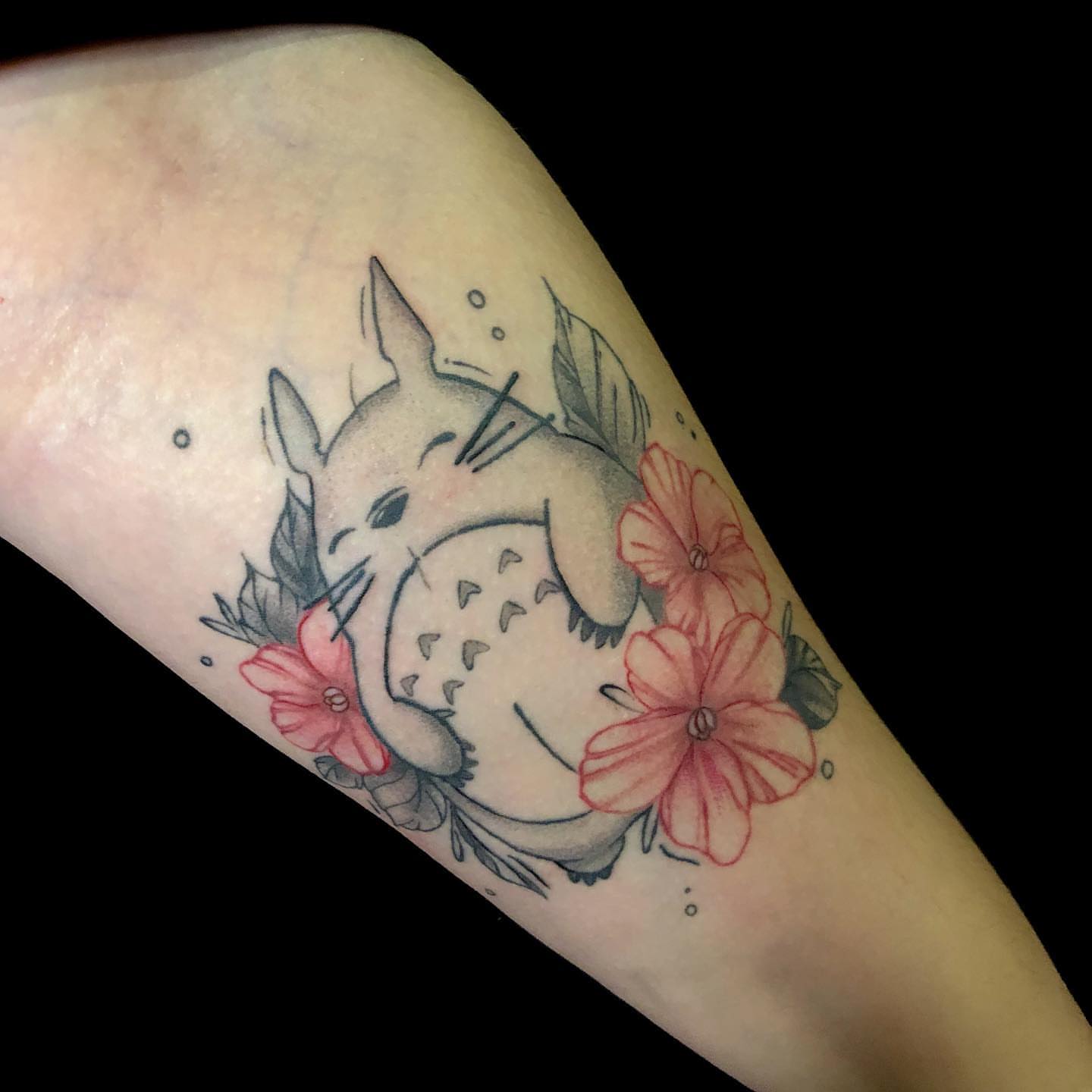 Totoro with flowers dotwork tattoo on the forearm by NYC