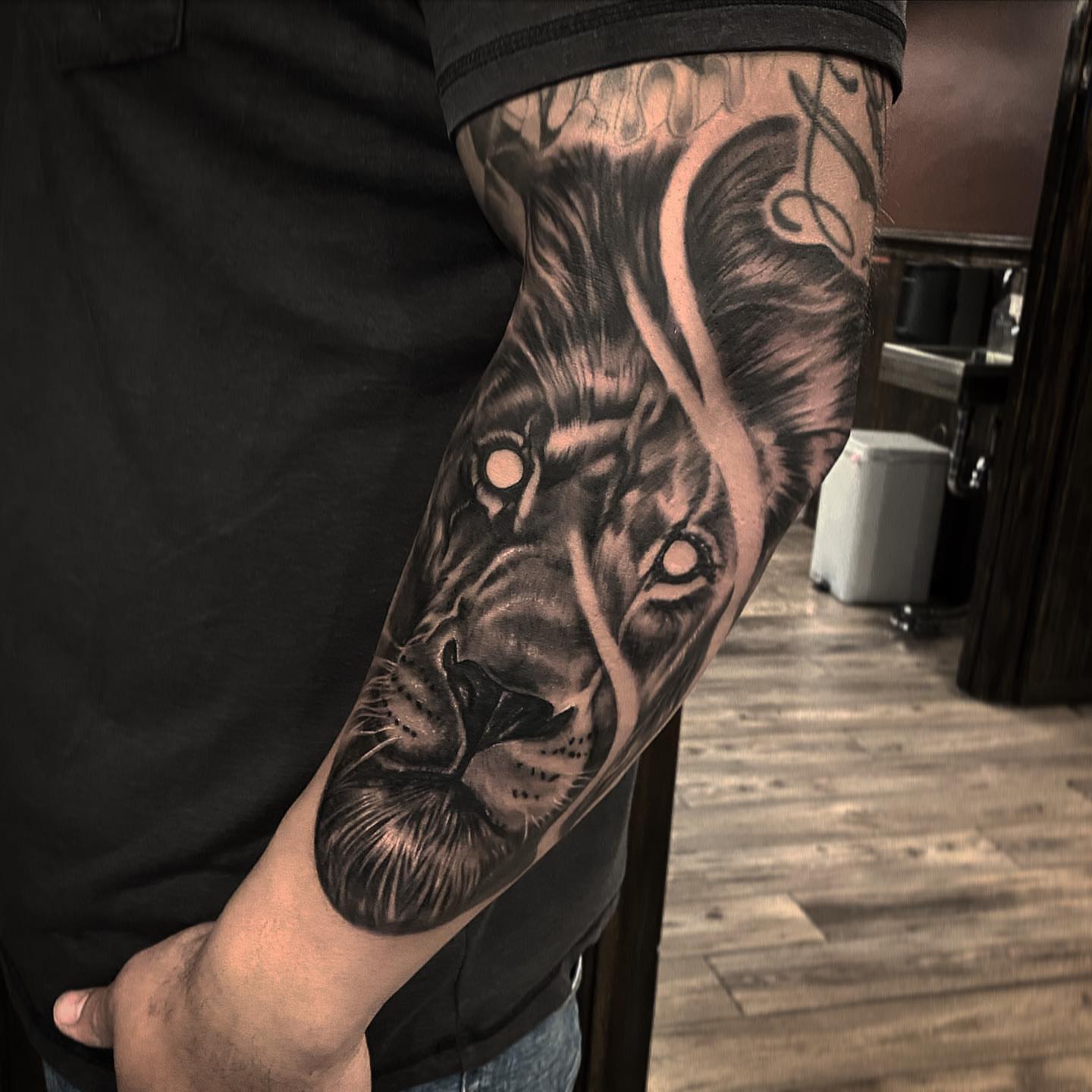 Lion realism tattoo on the forearm by ⠀⠀ ⠀ ⠀ ⠀⠀ ⠀⠀ ⠀⠀ ⠀ ⠀⠀ ⠀⠀ᎪᎳᏃ, West Hollywood, California