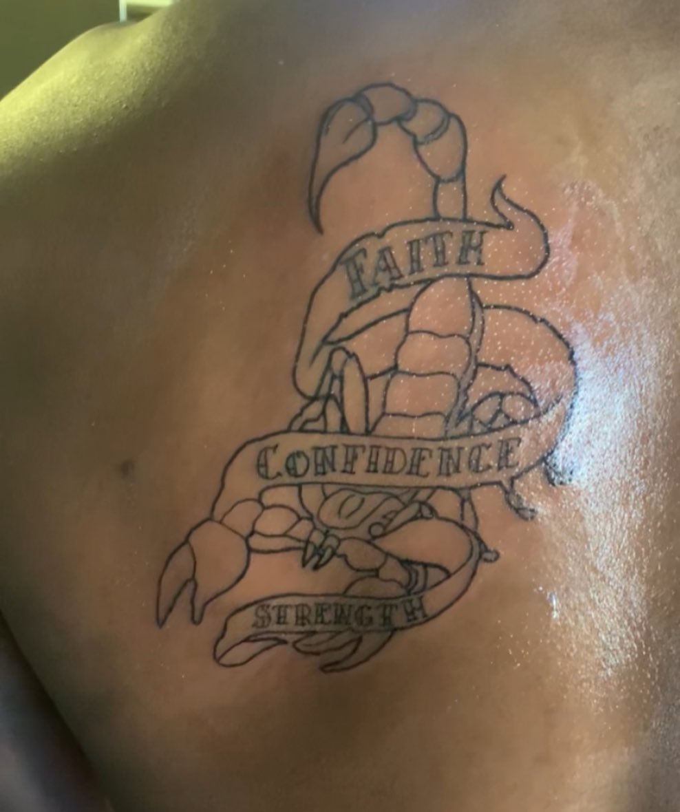 Crab with banners American traditional tattoo on the back by Wichita Tattoo
