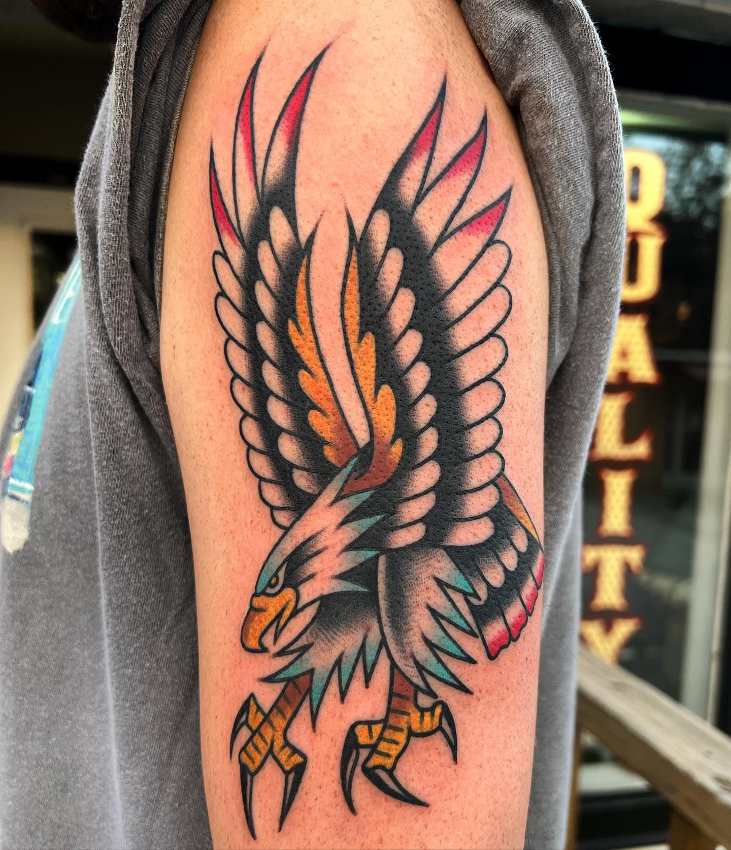 Eagle American traditional tattoo on the upper arm by Daniel Mesen