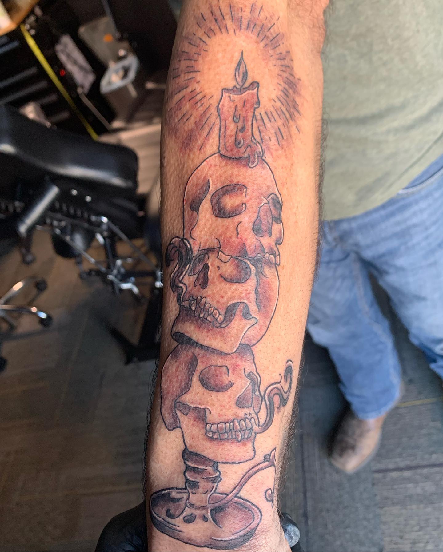 Skulls and candle American traditional tattoo on the forearm by Wichita Tattoo