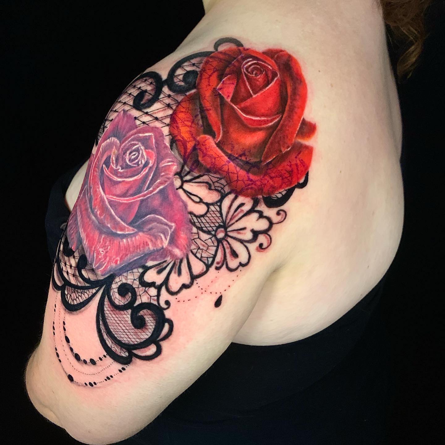 Red roses realism tattoo on the shoulder by David Gordon
