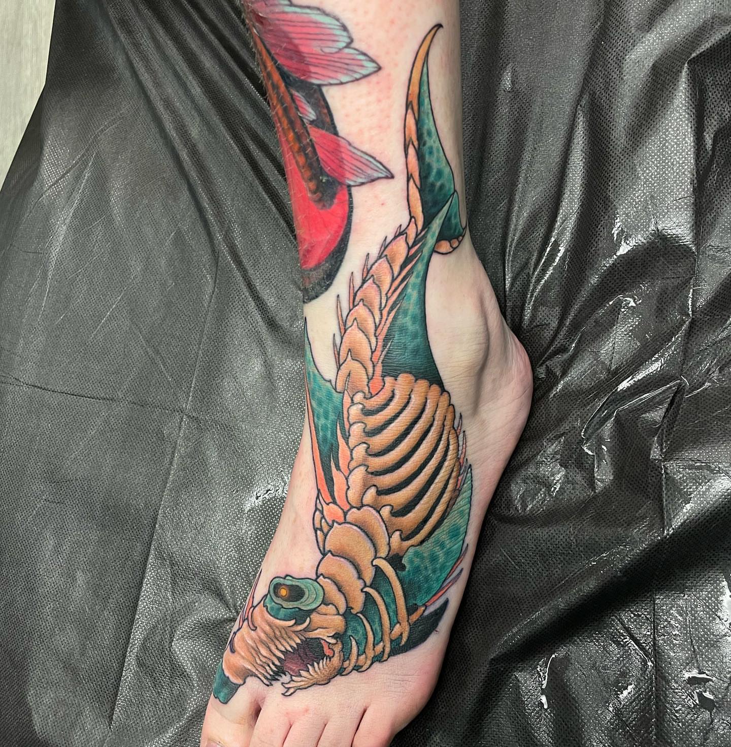 Koi fish American traditional tattoo on the foot by Erin Chance