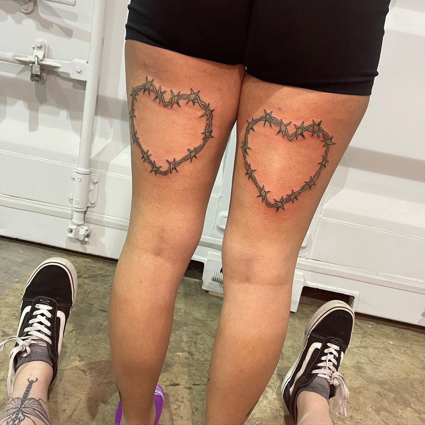 Barbed wire heart black and grey tattoo on the thigh by Sarah Bobby, Houston, Texas
