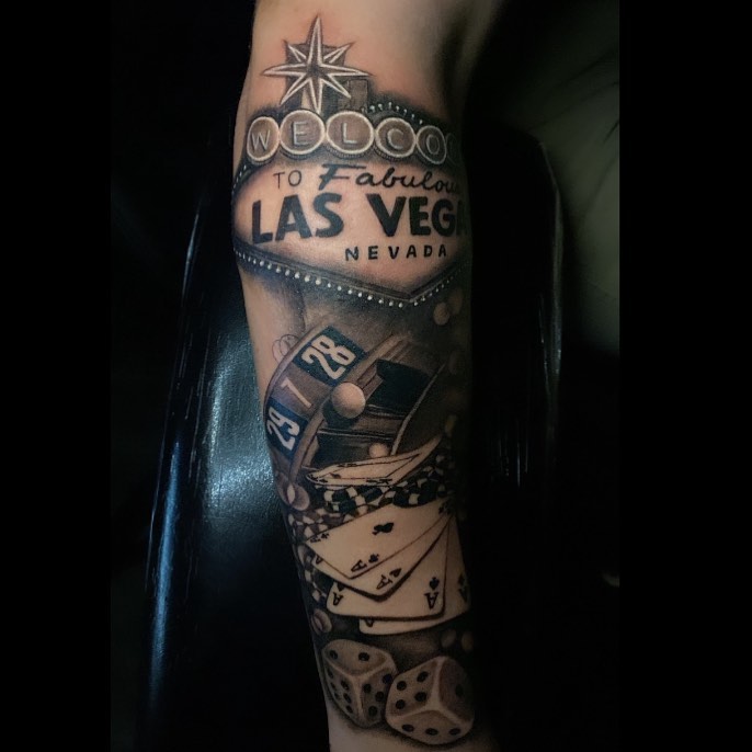 Las Vegas sign black and grey tattoo on the forearm by Las Vegas Tattoo Artist