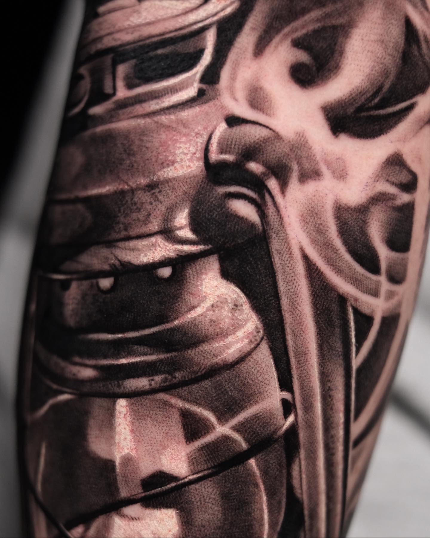 Mecha helmet realism tattoo on the forearm by Anton Martiushev