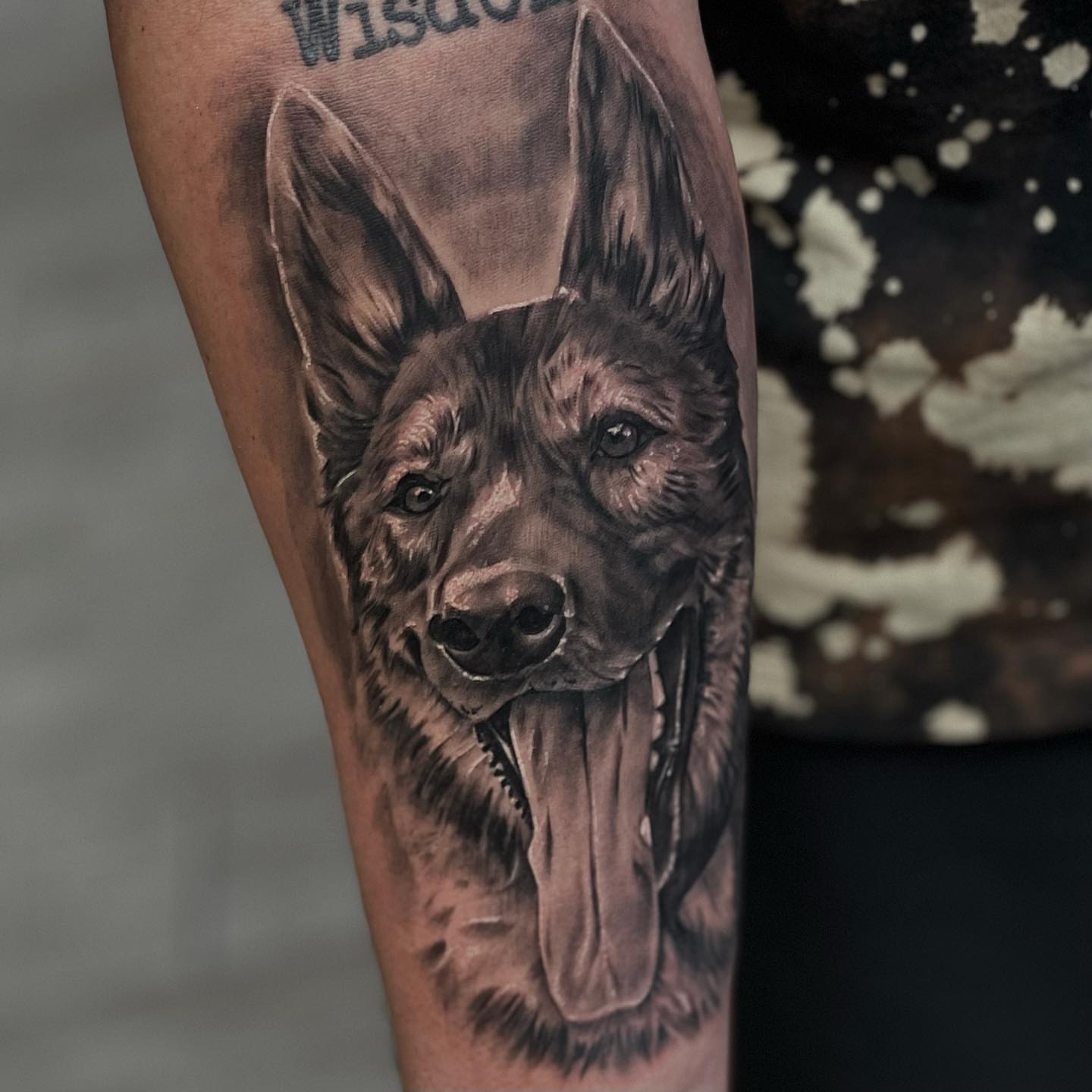 Dog realism tattoo on the forearm by Aaron Watson