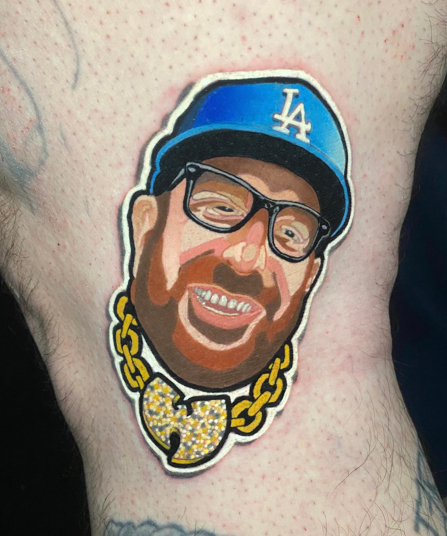 Hip hop character realism tattoo on the thigh by Brian Horowitz