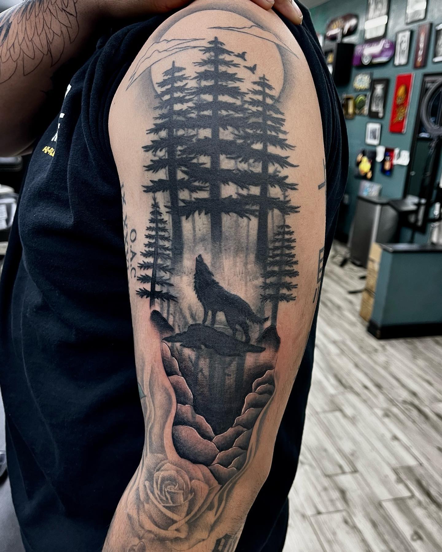 Wolf howling in forest realism tattoo on the forearm by Monique Ortiz, Mesa, Arizona