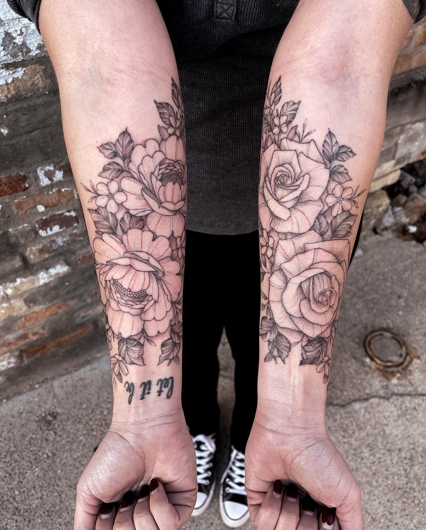 Floral bouquet black and grey tattoo on the forearm by Michigan Tattoo Artist