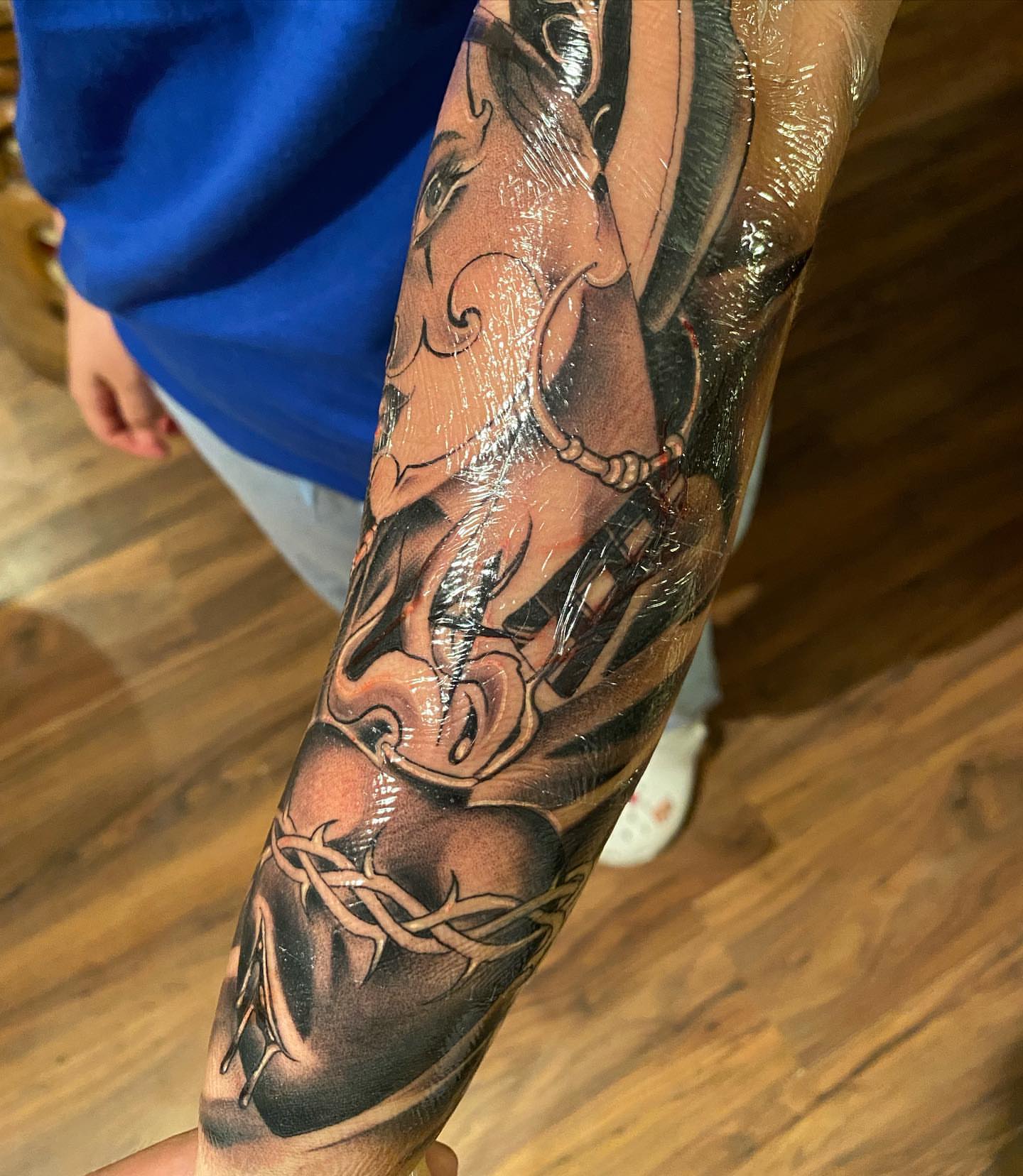 Woman with dragon American traditional tattoo on the forearm by LifesGrape