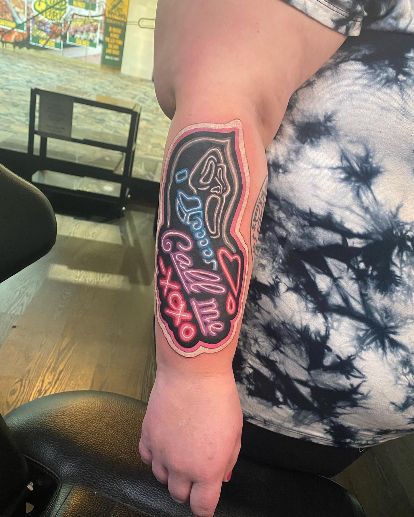 Neon sign lettering script tattoo on the forearm by Seth Scott
