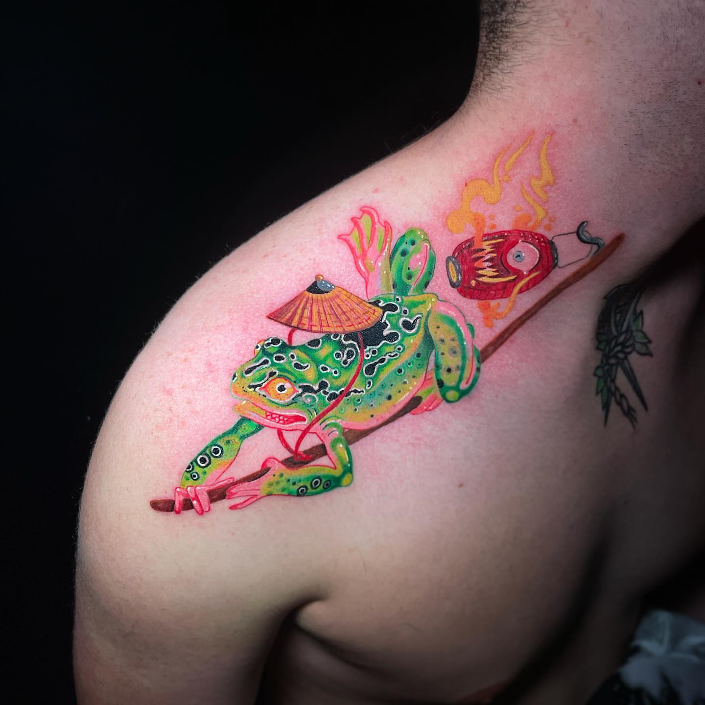 Frog with umbrella and lantern new school tattoo on the shoulder by El Bryan Tattoos