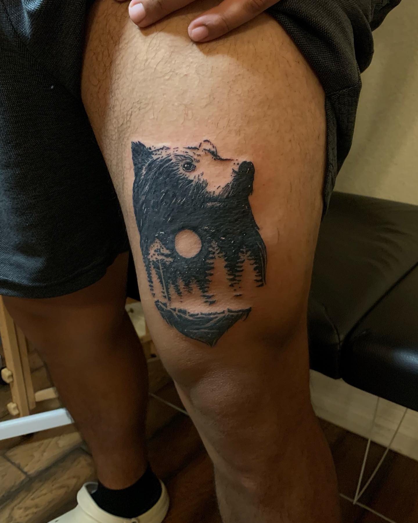 Bear black and grey tattoo on the thigh by Leo Torres