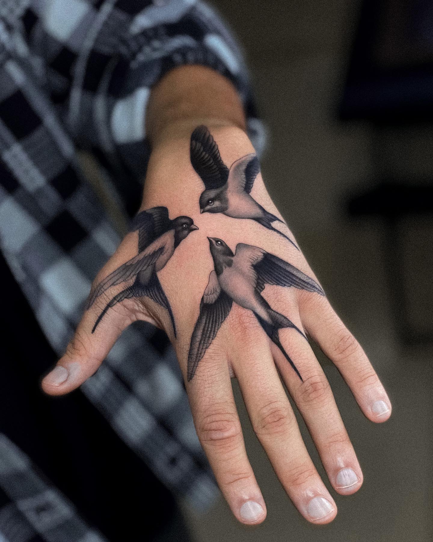 Birds realism tattoo on the hand by Oleksandr Moroz