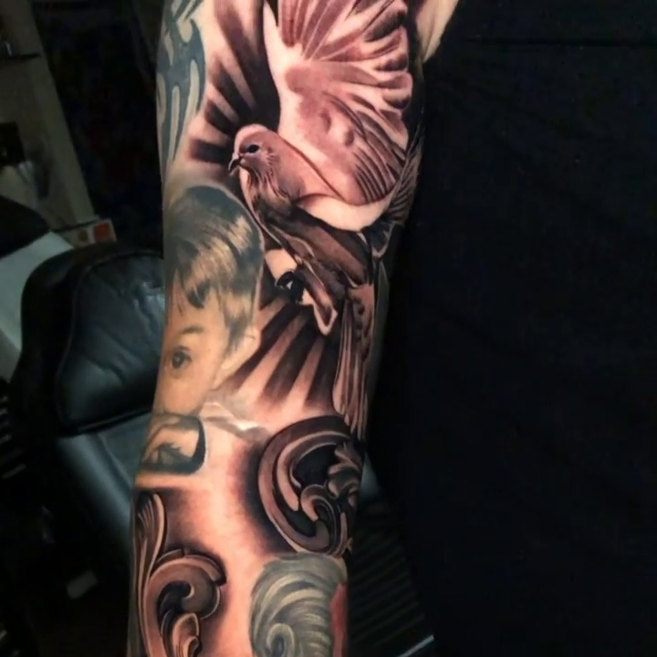 Dove and portrait realism tattoo by Michael Martinez