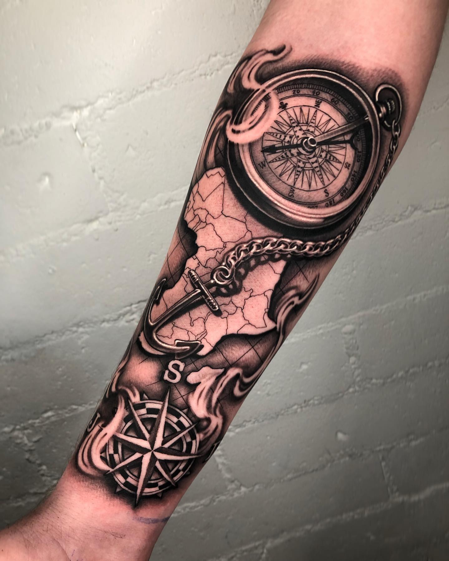 Compass and map realism tattoo on the forearm by David Torres