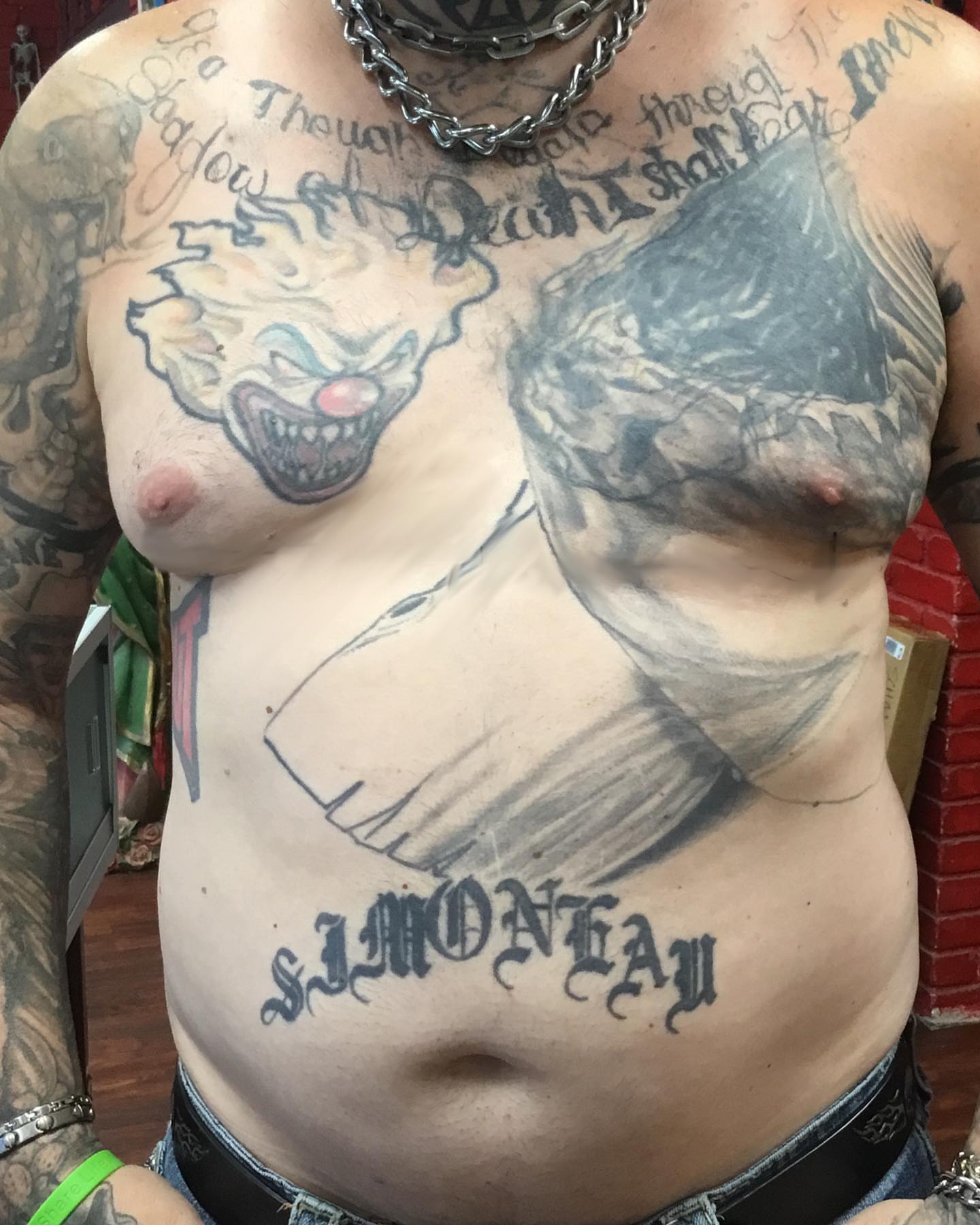 Clown and bird black and grey tattoo on the chest by Chuck House