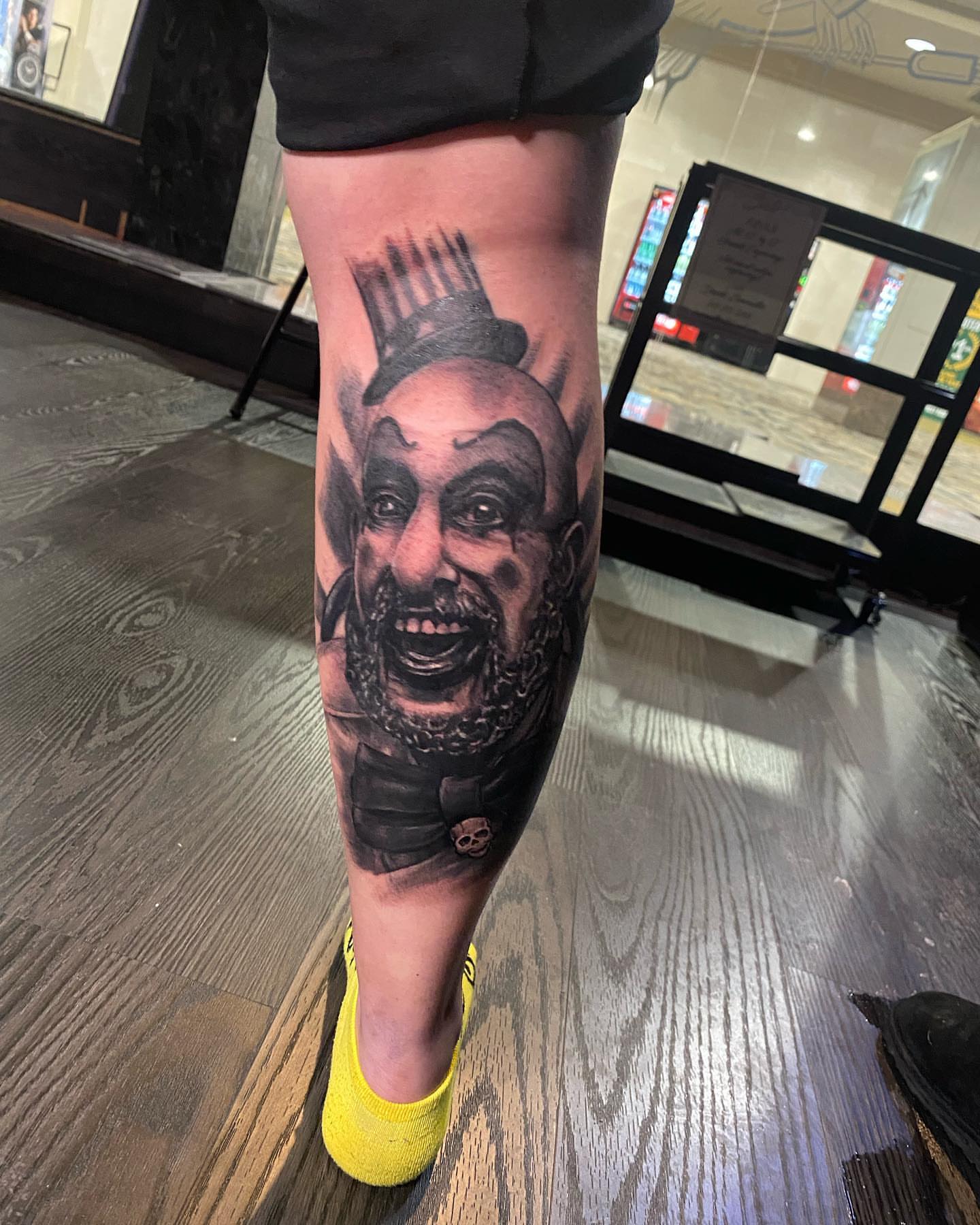 Clown realism tattoo on the calf by Seth Scott