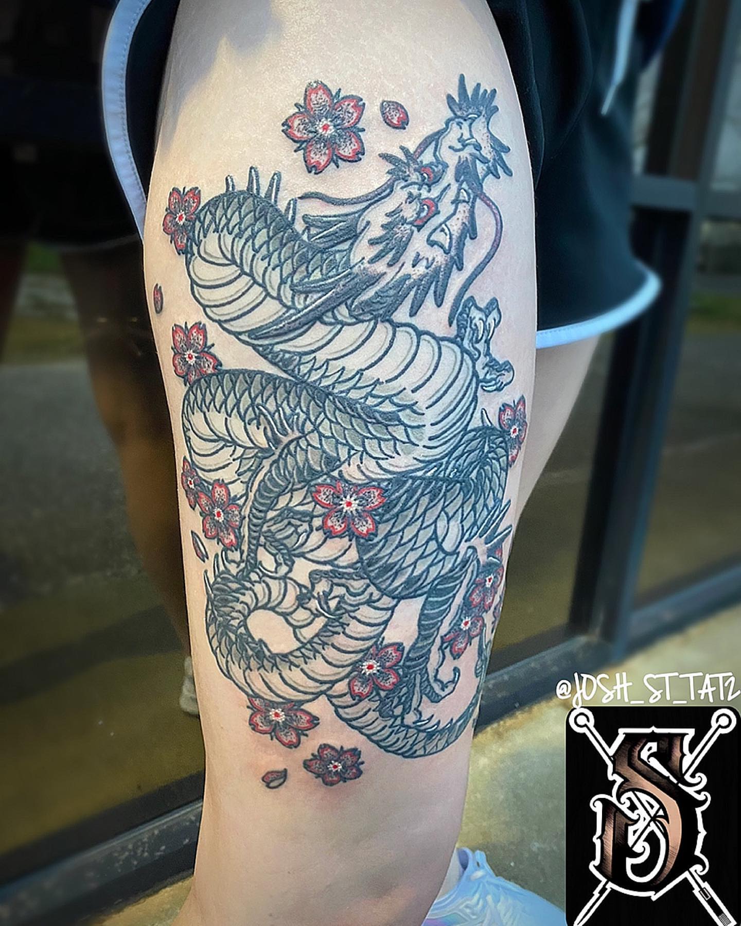 Dragon and cherry blossoms japanese irezumi tattoo on the forearm by Josh St.germain