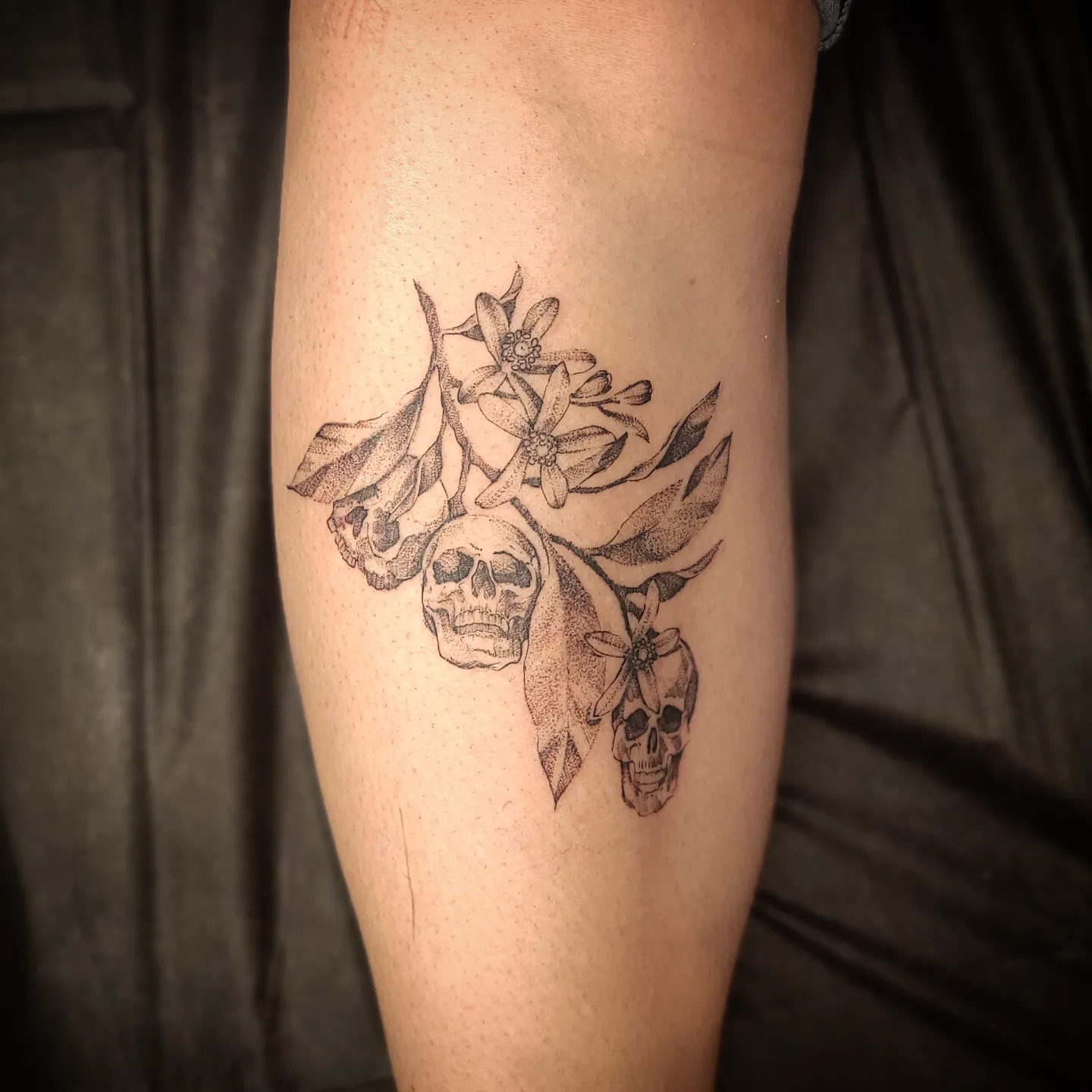 Skulls and flowers dotwork tattoo on the forearm by Shar - Utah Tattoo Artist