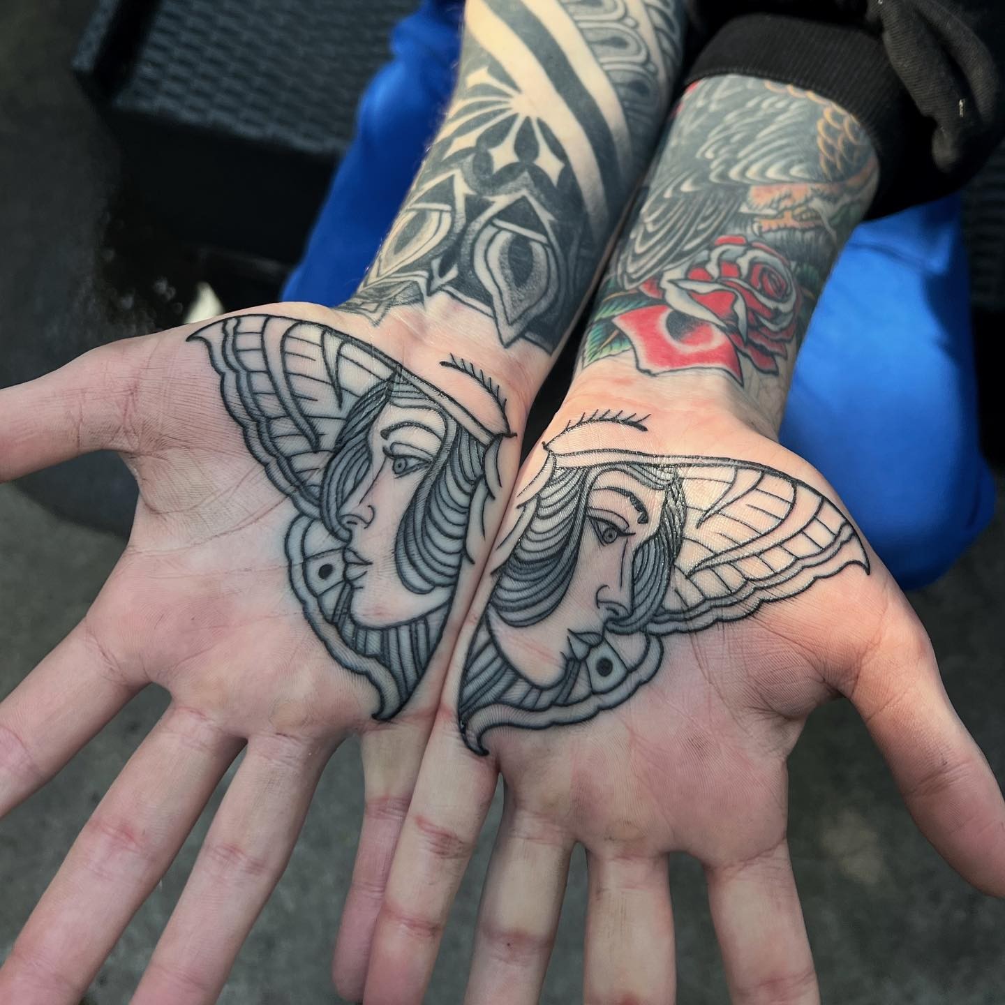 Winged woman American traditional tattoo on the hand by Mark Walker