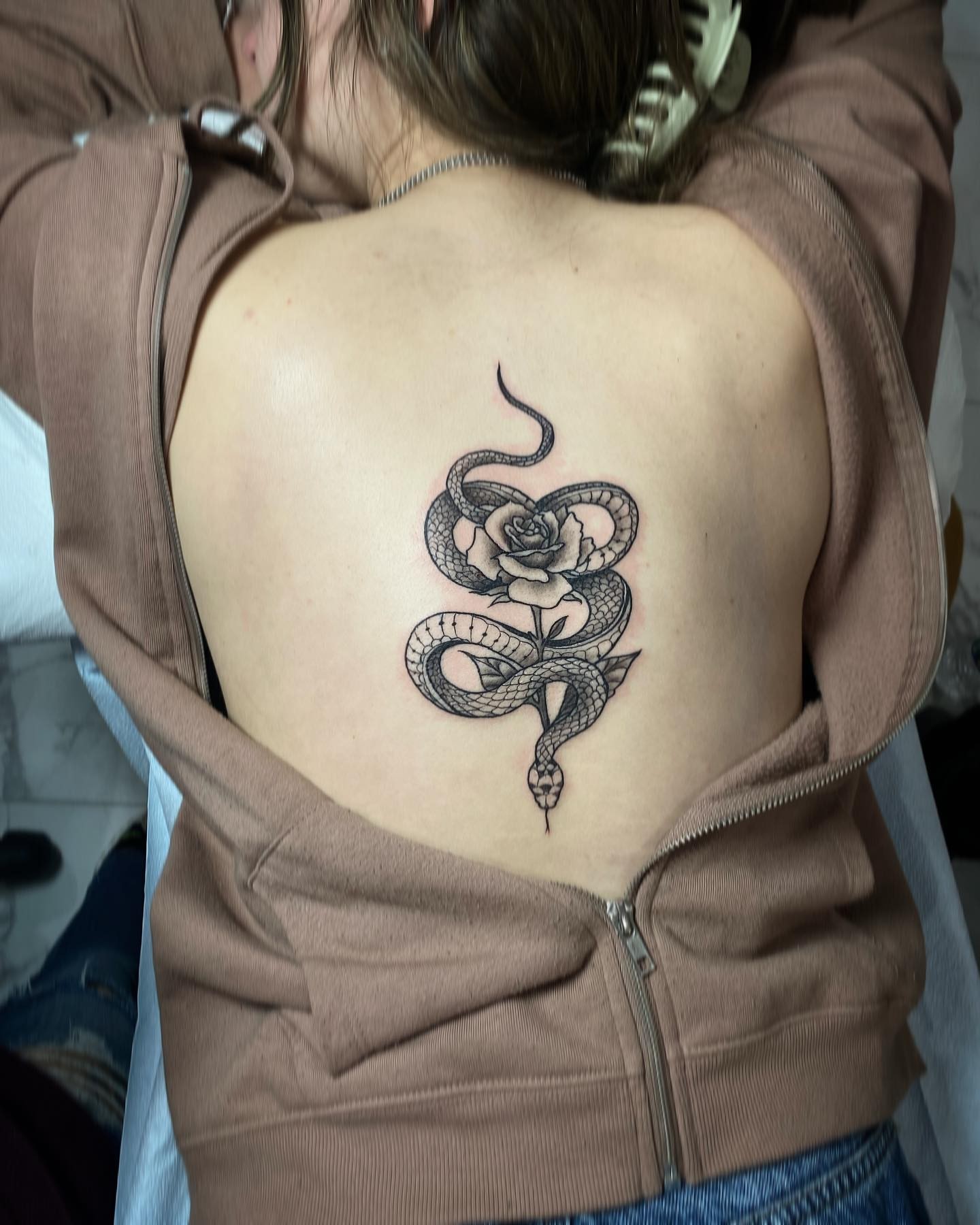 Snake and rose black and grey tattoo on the back by Mia