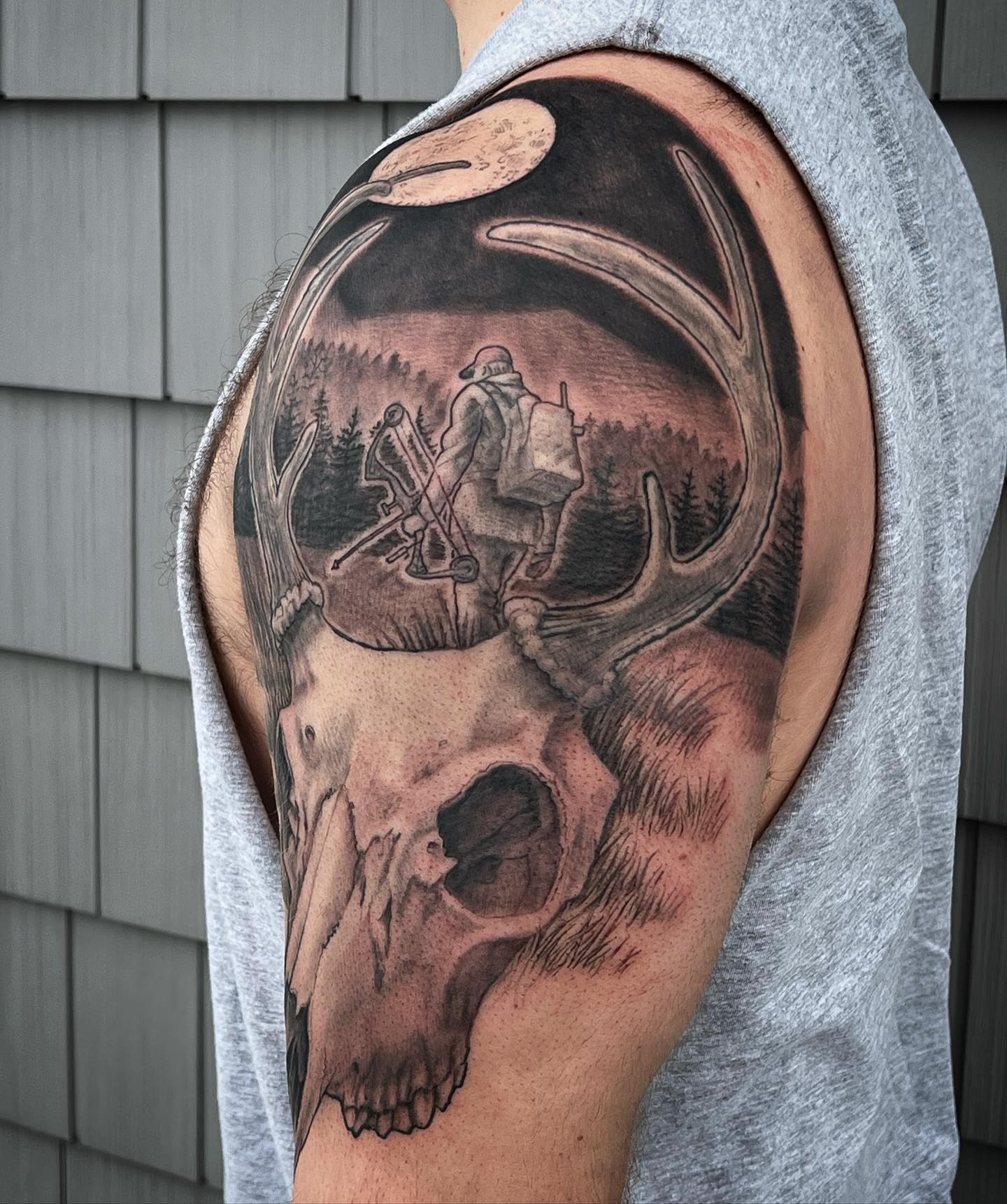 Skull and hunter realism tattoo on the shoulder by Iconic Ink, Millbury, Massachusetts