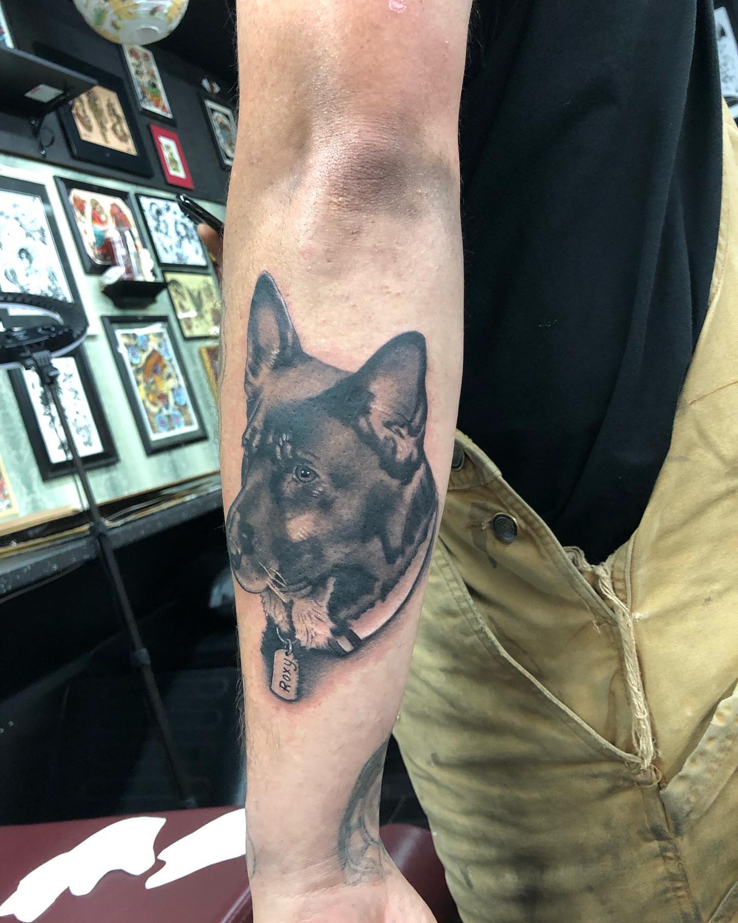 Dog realism tattoo on the forearm by Tattoos by Rey G.
