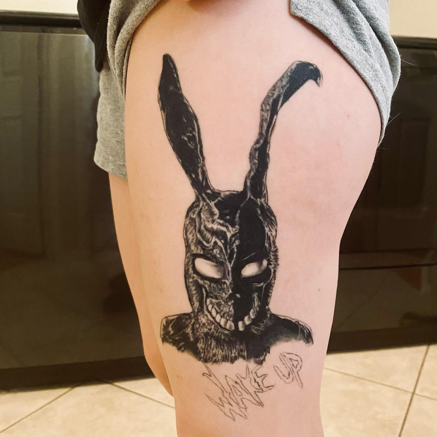 Donnie Darko rabbit skull dark realism tattoo on the thigh by KJ