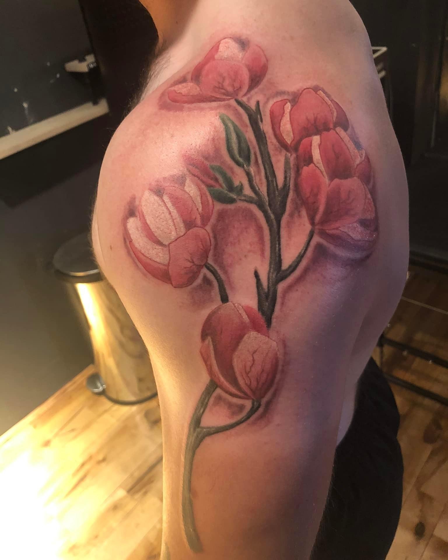Flowers realism tattoo on the shoulder by A.W.