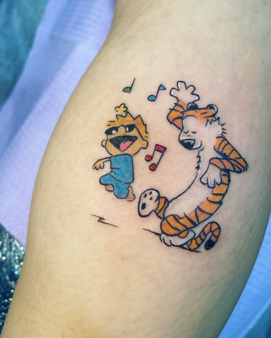 Calvin and Hobbes illustrative tattoo on the thigh by Sarah Bobby, Houston, Texas