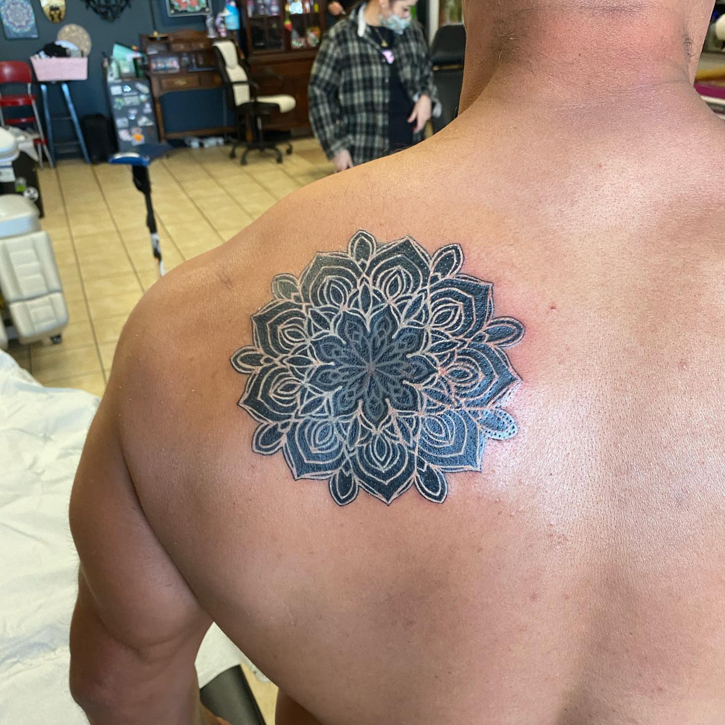 Mandala geometric tattoo on the back by Nicholas Jones