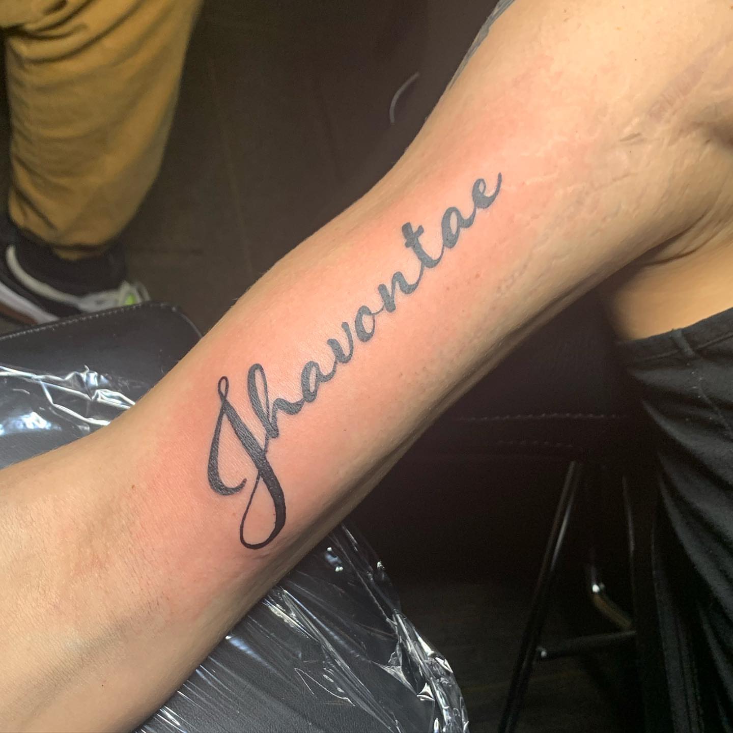 Jhavontae lettering script tattoo on the forearm by Wichita Tattoo