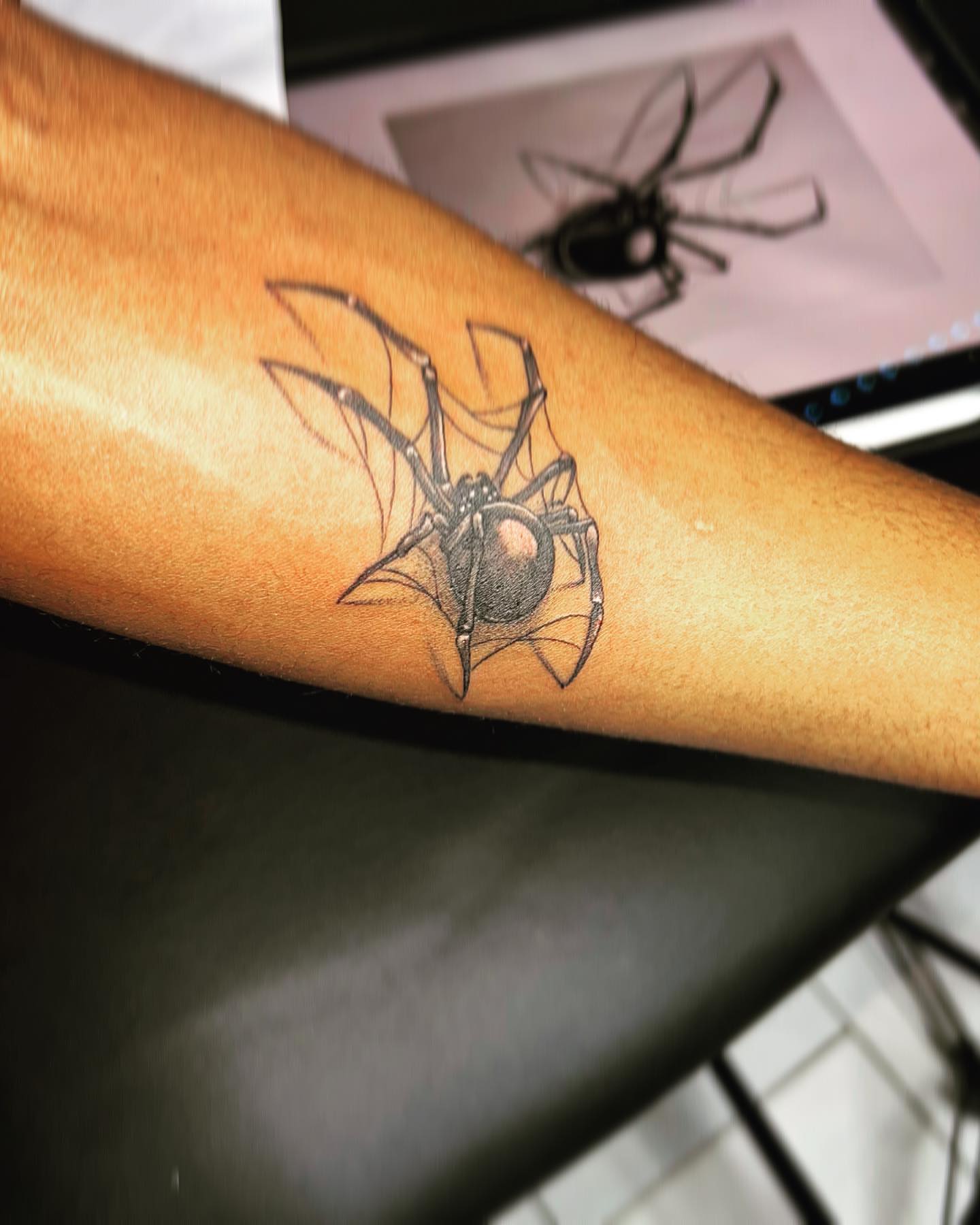 Spider black and grey tattoo on the forearm by oxideTattoo, Morne-à-l'Eau