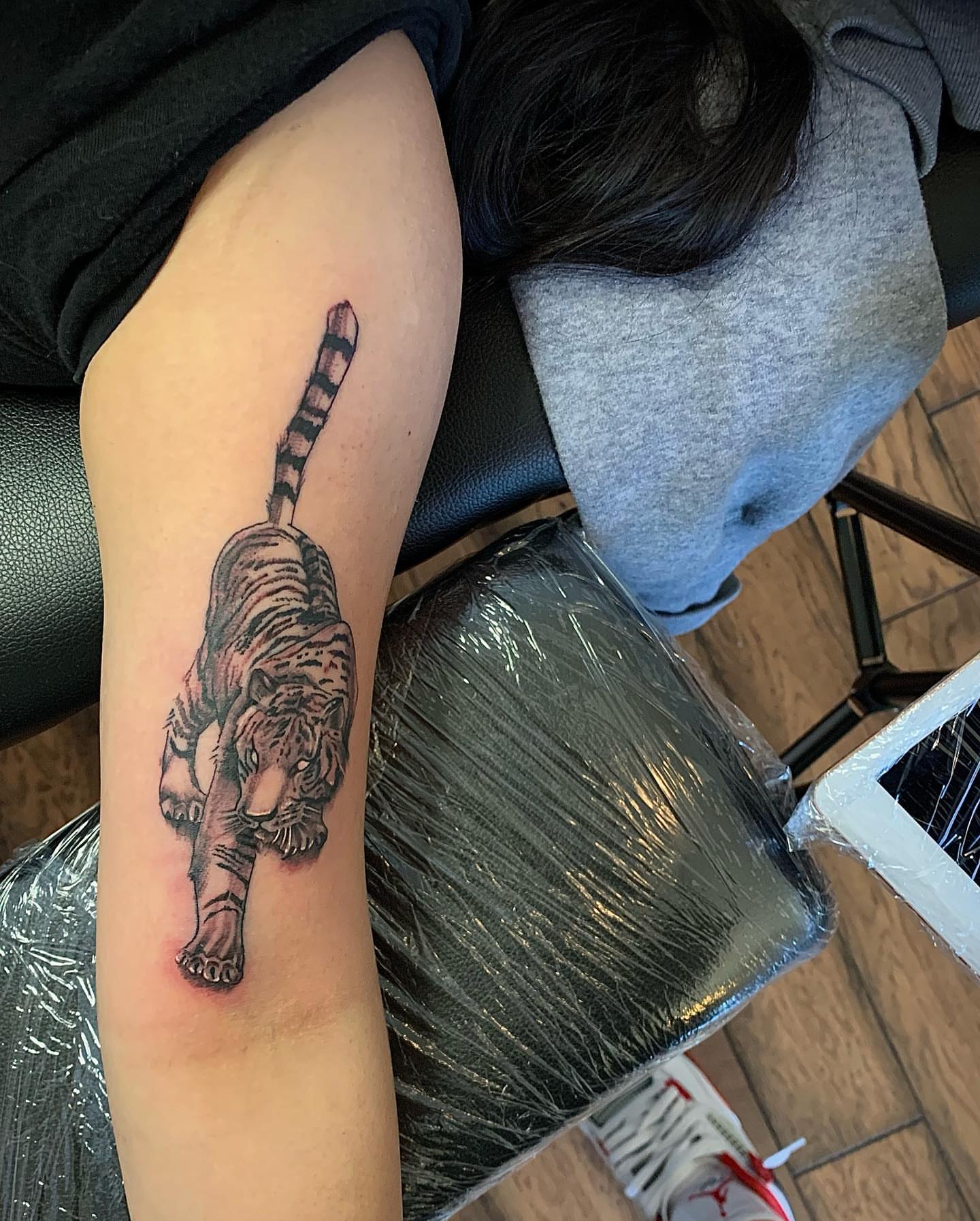 Tiger realism tattoo on the forearm by Leo Torres
