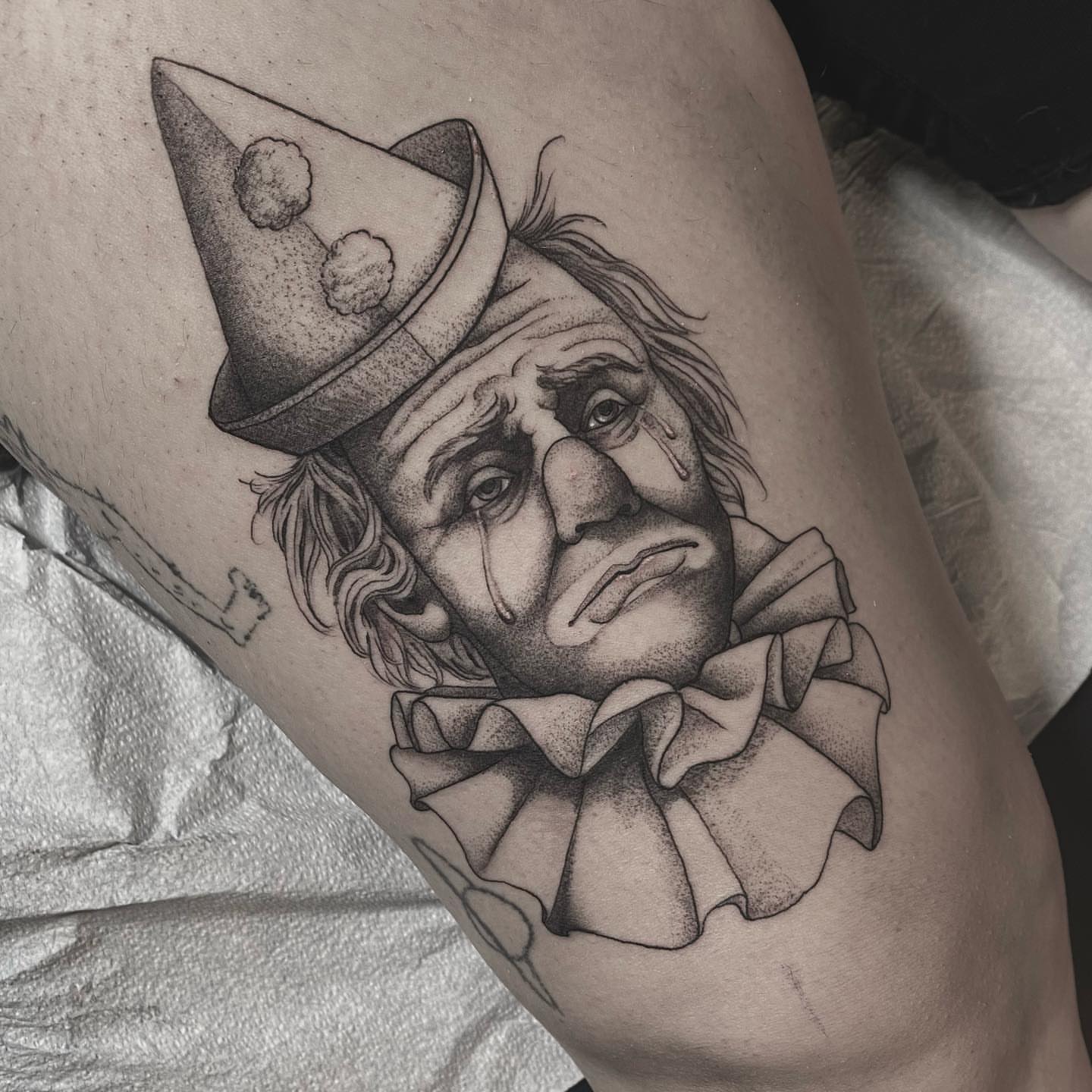 Clown dotwork tattoo on the thigh by Sam Fortney, Columbus, Ohio