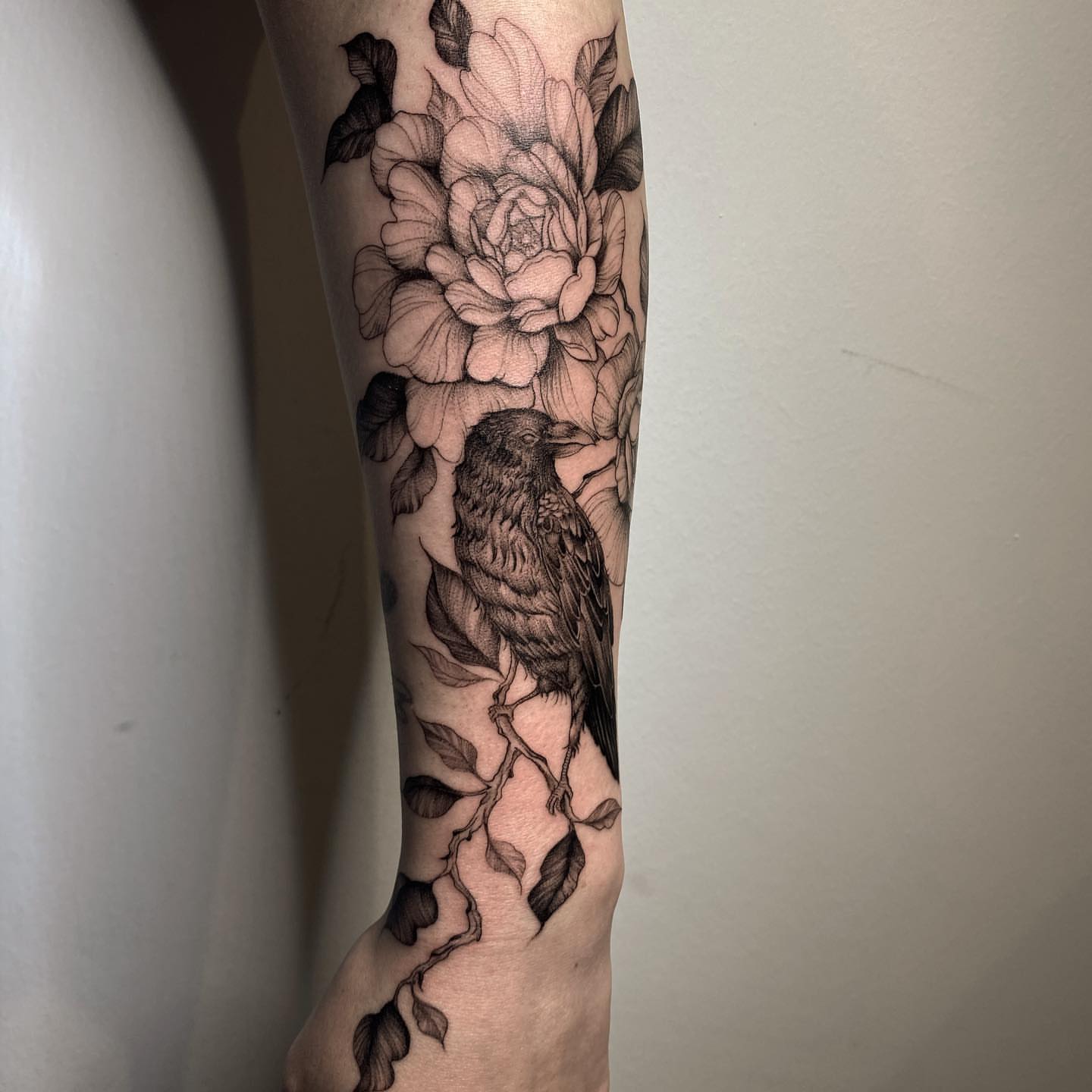 Bird and flowers realism tattoo on the forearm by Cindy Xu