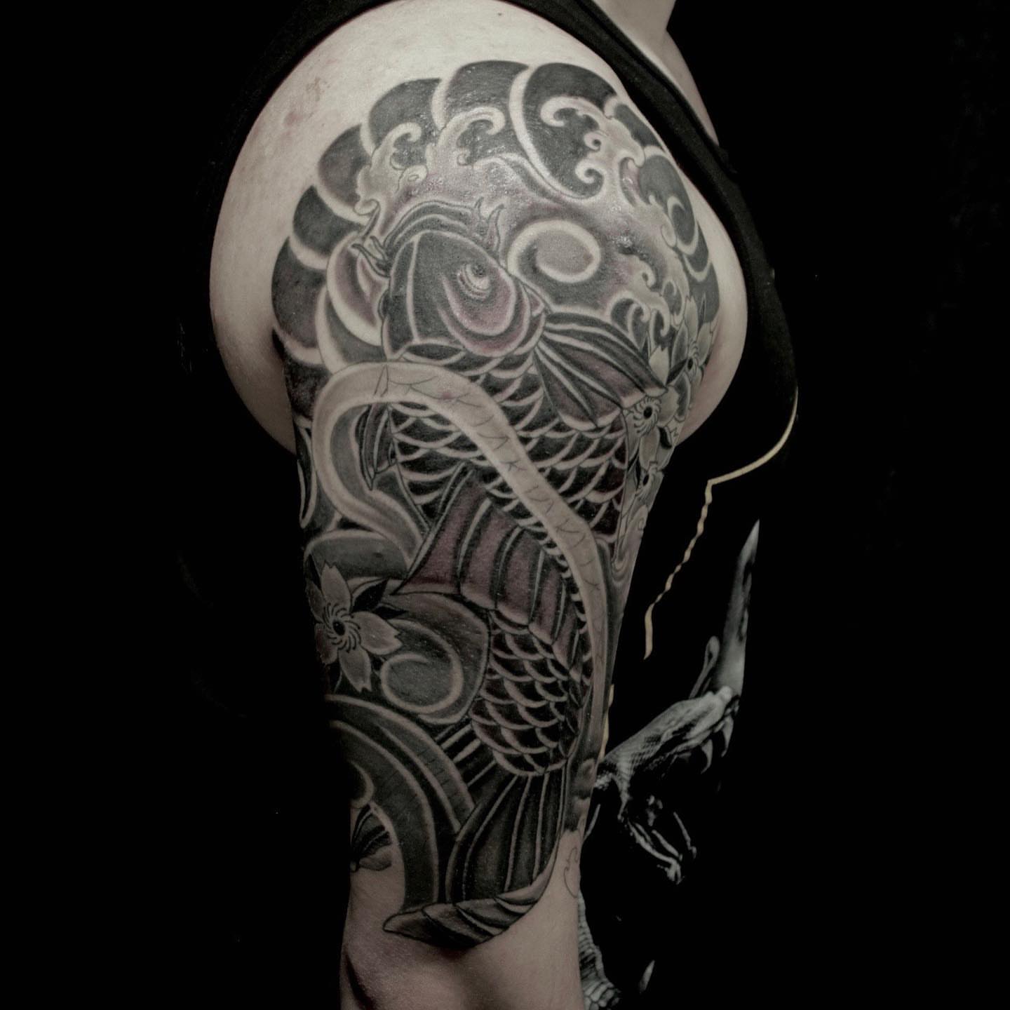 Koi fish japanese irezumi tattoo on the shoulder by Daniel Gutierrez